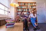 Image of students at a bookcase